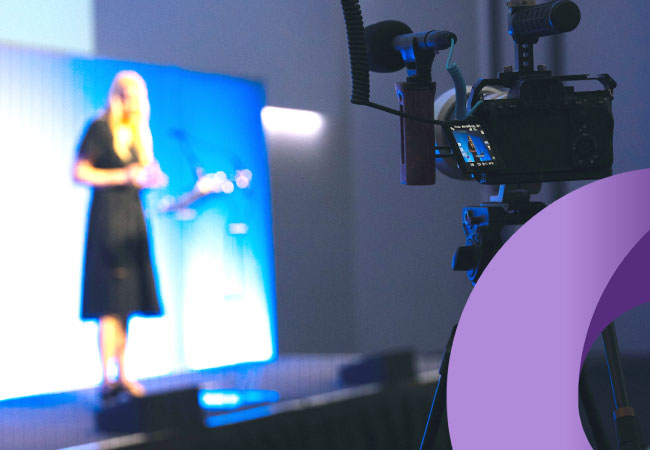 Woman presenting on stage